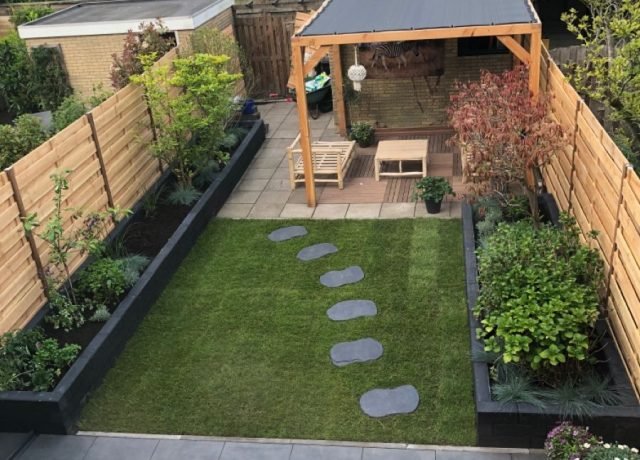 Stylish patio with paving stones and garden plants